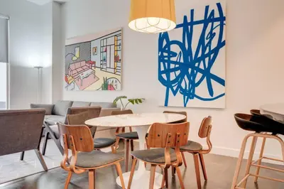 a dining room with a table and chairs at Best of Brickell's Luxury Suite with Pool and Gym in Miami