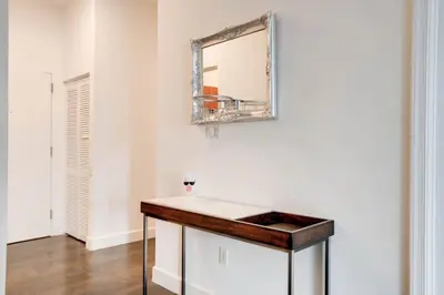 a bathroom with a sink and a mirror on the wall at Best of Brickell's Luxury Suite with Pool and Gym in Miami