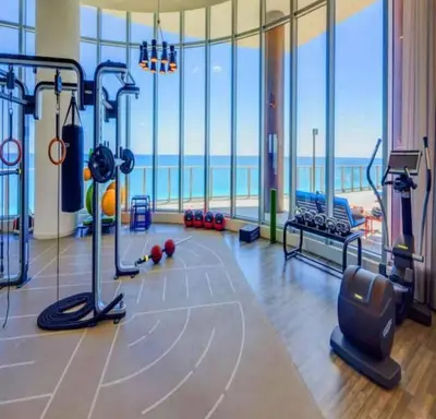 a fitness room with a gym with a view of the ocean at Amazing apartment - Lyfe Resort & Resident in Hollywood