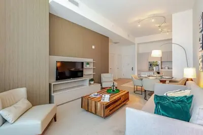 a living room with a couch and a table at Amazing apartment - Lyfe Resort & Resident in Hollywood
