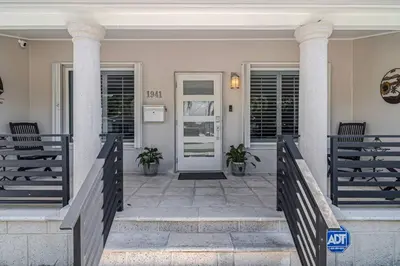 a front door of a house with two pillars at Casa la Miami - Central location Villa with Pool & Gym in Miami