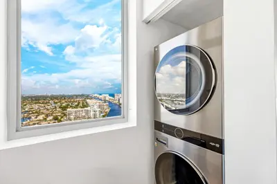 a washing machine in a room with a window at Beachwalk Resort - PENTHOUSE IN THE SKY 3BDR and 3BA LUXURY CONDO DIRECT OCEAN VIEW in Hallandale Beach