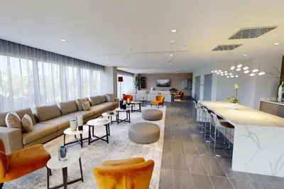 a large living room with a couch and a bar at APARTMENT FOR RENT 2 BED 2 BATH 1 Parking DOWNTOWN DORAL in Miami