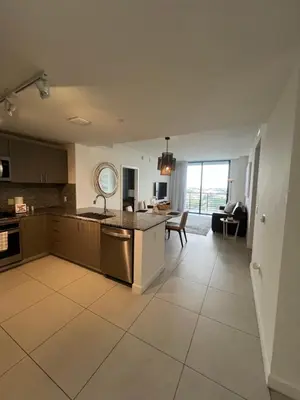 a kitchen and living room with a sink and a table at APARTMENT FOR RENT 2 BED 2 BATH 1 Parking DOWNTOWN DORAL in Miami