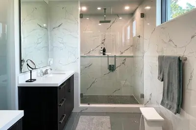 a bathroom with a shower and a sink at Topo Encanto - Designer Villa, Sundrenched Paradise! in Fort Lauderdale