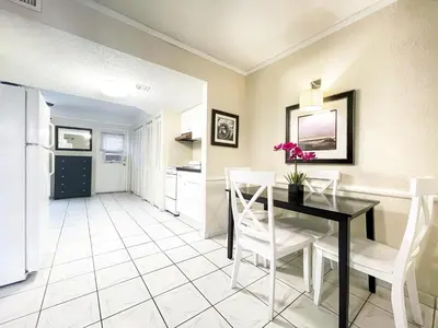 a kitchen and dining room with a table and chairs at Hollywood by the Sea in Hollywood