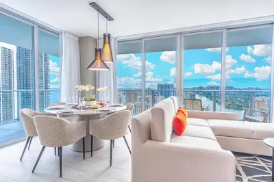 a living room with a white couch and a table at Hyde Beach House 2309 in Hollywood
