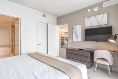 a bedroom with a bed and a desk and a tv at Hyde Beach House 2309 in Hollywood