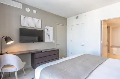 a bedroom with a bed and a tv on a wall at Hyde Beach House 2601 in Hollywood