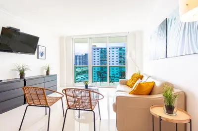a living room with a couch and chairs at Ocean Reserve 1006 in Miami Beach