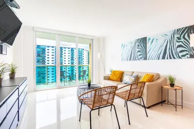 a living room with a couch and chairs at Ocean Reserve 1006 in Miami Beach