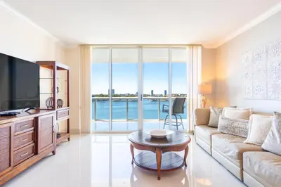 a living room with a couch and a table at Golden Bay 703 in Miami Beach