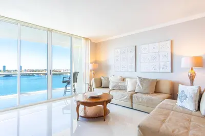 a living room with a couch and a table at Golden Bay 703 in Miami Beach