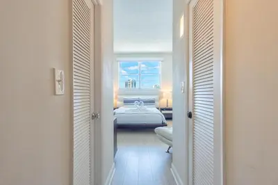 a bedroom with a bed and a window at Ocean Reserve PH6 in Miami Beach