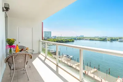 a balcony with a view of the water at Golden Bay 808 in Miami Beach