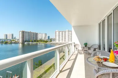 a balcony with a view of the water at Golden Bay 808 in Miami Beach