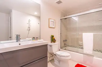a bathroom with a sink and a toilet and a shower at Ocean Reserve 725 in Miami Beach