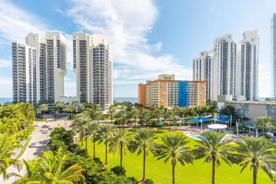 a city with palm trees and tall buildings at Ocean Reserve 725 in Miami Beach
