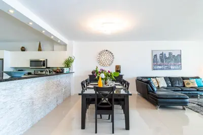 a living room with a table and a couch at Golden Bay 805 in Miami Beach