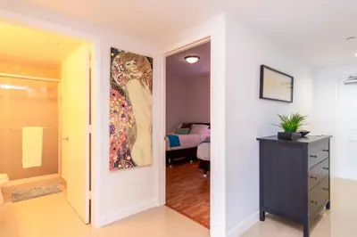a room with a painting of a woman on the wall at Golden Bay 805 in Miami Beach