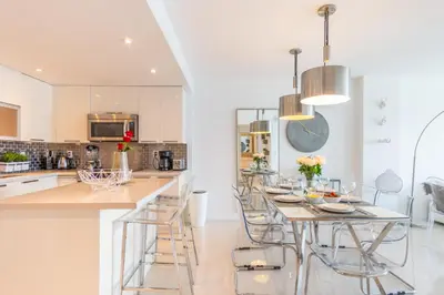 a kitchen with a table and chairs in a kitchen at Ocean Reserve 1508 in Miami Beach