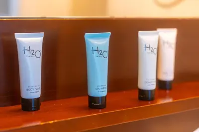 a row of four products on a shelf at Marina Bay 1103 in Miami Beach