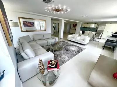 a living room with a white couch and a table at WOW! Best Location! Best Unit! New Renovated South Beach Ocean Front in Miami Beach