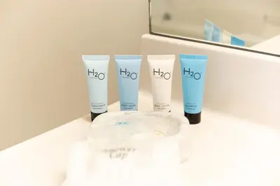 a group of four products sitting on a counter at Golden Bay 707 in Miami Beach