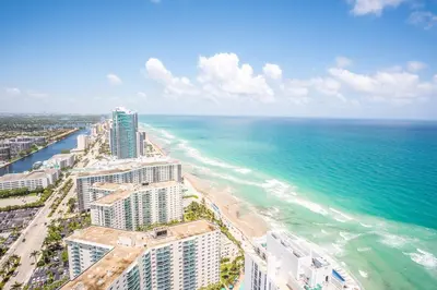 an aerial view of the beach and the ocean at Lyfe Beach Resort 3604 in Hollywood Beach