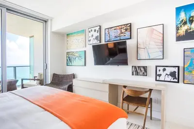 a bedroom with a bed and a desk at Lyfe Beach Resort 3604 in Hollywood Beach