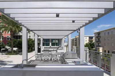 a patio with a table and a grill on a balcony at Coral Gables 1BR w WD Pool Gym nr Shops MIA-9 in Miami