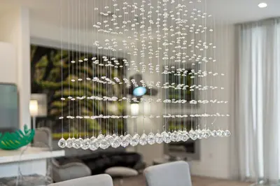 a chandelier is hanging in a living room at City Forest One,Brand New Living, Executive /1Gb/s in Miami