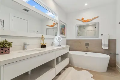 a white bathroom with a tub and a large mirror at City Forest One,Brand New Living, Executive /1Gb/s in Miami