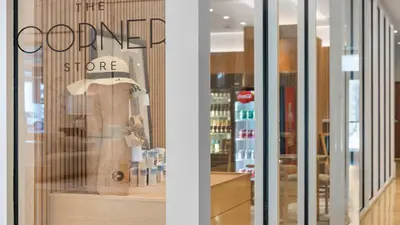 a store window with a sign that reads the corner store at 1 Bedroom Private Residence at Carillon Miami Resort -911 in Miami Beach