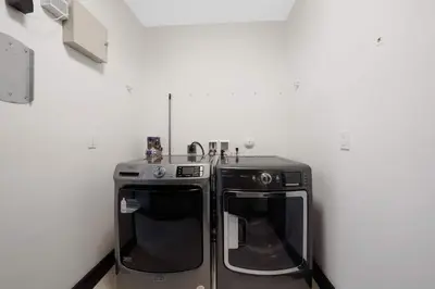 a kitchen with a stove and a dishwasher at Luxury home w pool by PMI in Miami