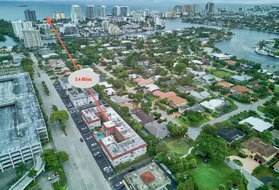 an aerial view of a city with a red arrow that says villages at Ft Lauderdale Jewel in Fort Lauderdale