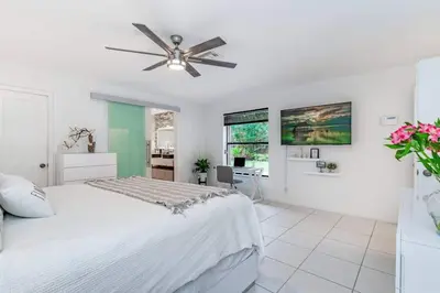 a bedroom with a bed and a ceiling fan at Fox Private Resort-Heated Pool, Spa-Downtown&Beach in Fort Lauderdale