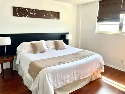 a bedroom with a large bed with white sheets at Beautiful Apartment in Sunny Isles STR-01432 in Miami Beach