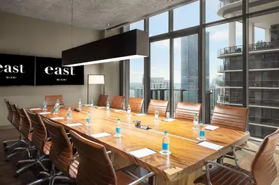 a large conference room with a long table and chairs at EAST Miami Residences in Miami