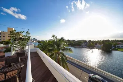 a balcony with a view of a river at Venezia Hotel By At Mine Hospitality in Miami Beach
