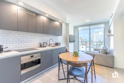a kitchen and living room with a table and a couch at Downtown Miami Condos by Lua Host in Miami