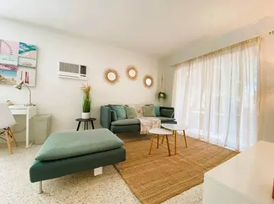 a living room with a couch and a table at Cozy Apartment Near Brickell in Miami