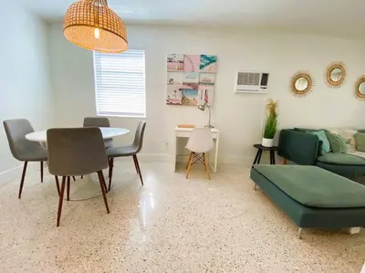 a living room with a table and a couch at Cozy Apartment Near Brickell in Miami