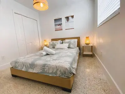 a bedroom with a bed with two lamps on it at Cozy Apartment Near Brickell in Miami