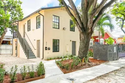 a house with a tree in front of it at Lovely Apartment Near Brickell 2 in Miami