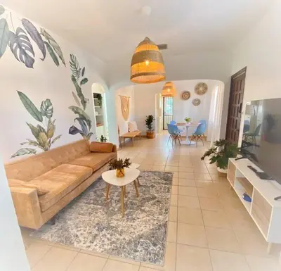 a living room with a couch and a table at Tropical Charm Little Havana Calle Ocho 2 in Miami