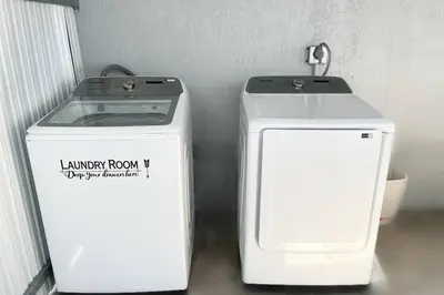 two machines are sitting next to each other at Amazing & cozy Duplex near Zoo Miami ! in Miami