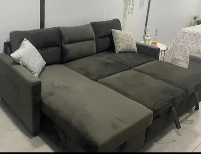 a brown couch with two pillows on top of it at Beautiful House 7 min from Miami Airport w FREE parking in Miami