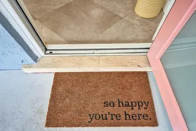a door with a sign that says so happy youre here at Water Front Home with Boat Dock Hot Tub Roof Top Fire Pit in Fort Lauderdale