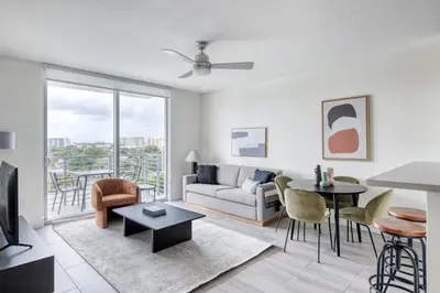 a living room with a couch and a table at Little Havana 1br w pool gym near restaurants MIA-48 in Miami